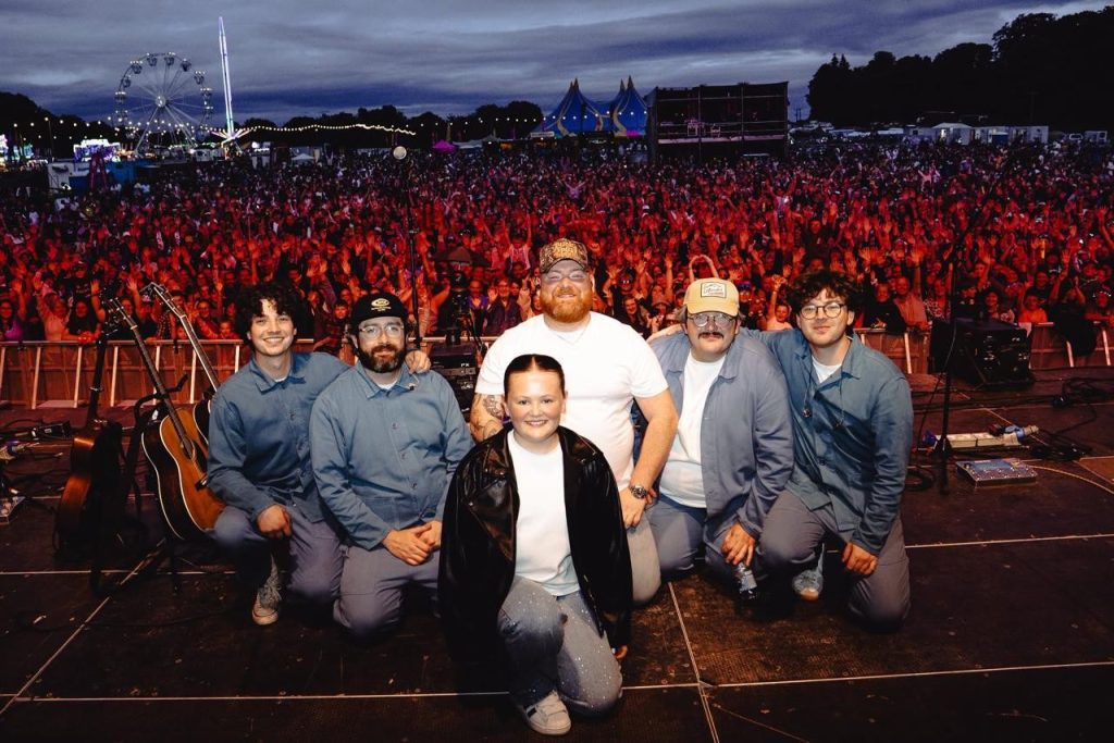 A band taking the applause at the end of a set